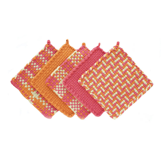 Five solid color and patterned potholders made of orange, yellow, and pink pro loops