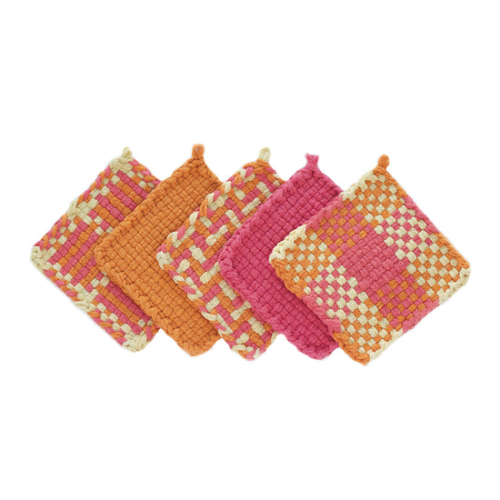 Five solid color and patterned potholders made of yellow, pink, and orange loops